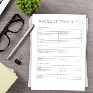 Printed Page on a desk. Example of one of the pages in the Rental Property Planner Bundle - Account Tracker