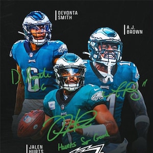 May include: A black and green digital illustration of three Philadelphia Eagles football players wearing their uniforms and helmets. The players are DeVonta Smith, A.J. Brown, and Jalen Hurts. The image includes the text "Hurts So Good" and the team logo.