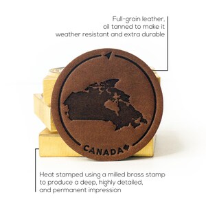 May include: Brown leather patch featuring a map of Canada with the word "CANADA" embossed in the centre. The patch is heat-stamped using a milled brass stamp to create a deep, detailed impression.