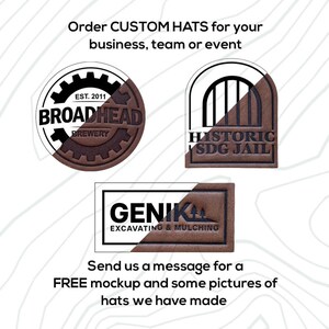 May include: Three brown leather patches with white text. The first patch is round and says "EST. 2011 BROADHEAD BREWERY". The second patch is arched and says "HISTORIC SDG JAIL". The third patch is rectangular and says "GENIKAA EXCAVATING & MULCHING".