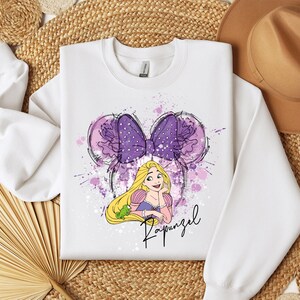 a white shirt with a picture of a princess on it