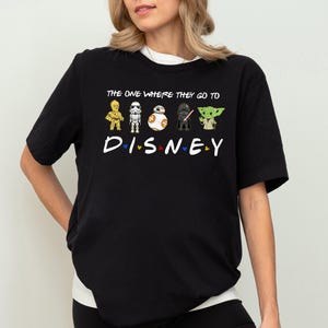 a woman wearing a black tshirt that says the one where they do disney
