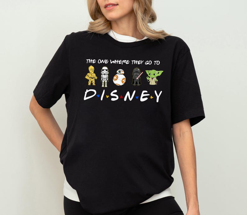 a woman wearing a black tshirt that says the one where they do disney