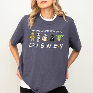 a woman wearing a t - shirt that says the one where they go to disney