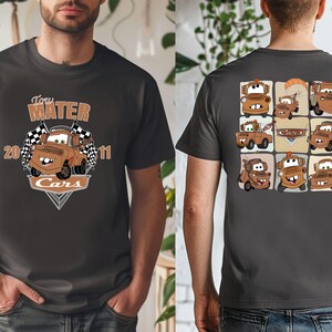 A man wearing a black t-shirt with a graphic design featuring multiple cartoon cars.