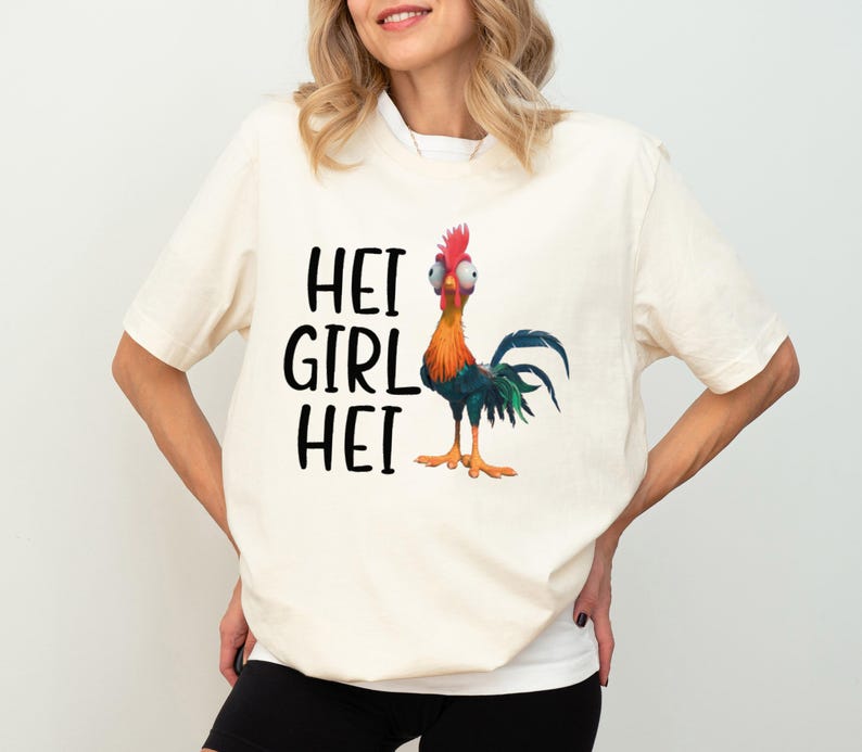 a woman wearing a t - shirt with a rooster on it