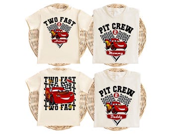 May include: Four off-white t-shirts featuring red race car graphics and checkered flags. Two shirts display the text TWO FAST with names Arthur or repeated text, while two shirts display PIT CREW with Mommy or Daddy labels and the number 2.