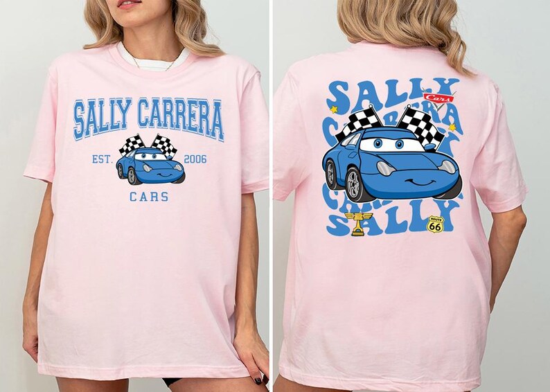 a woman wearing a pink shirt with a blue car on it