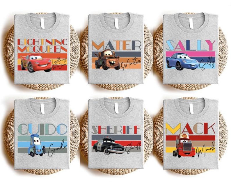 a set of four t - shirts with cars on them