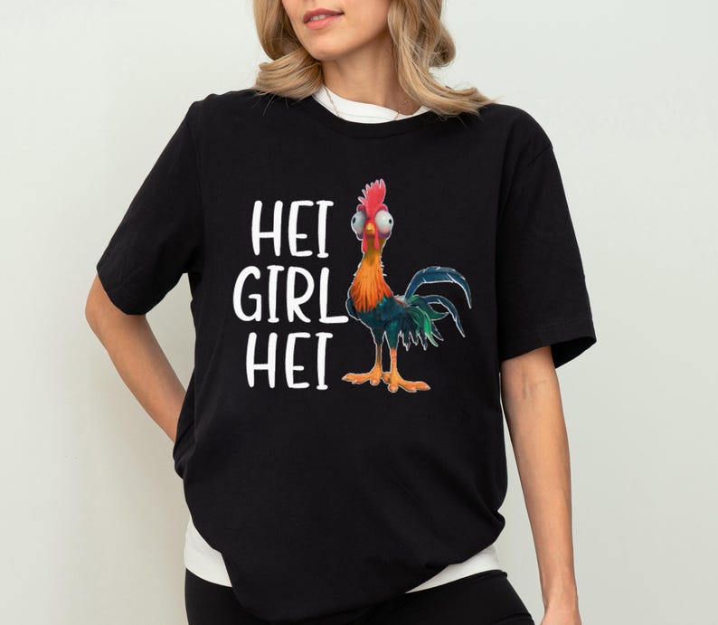 a woman wearing a black shirt with a rooster on it
