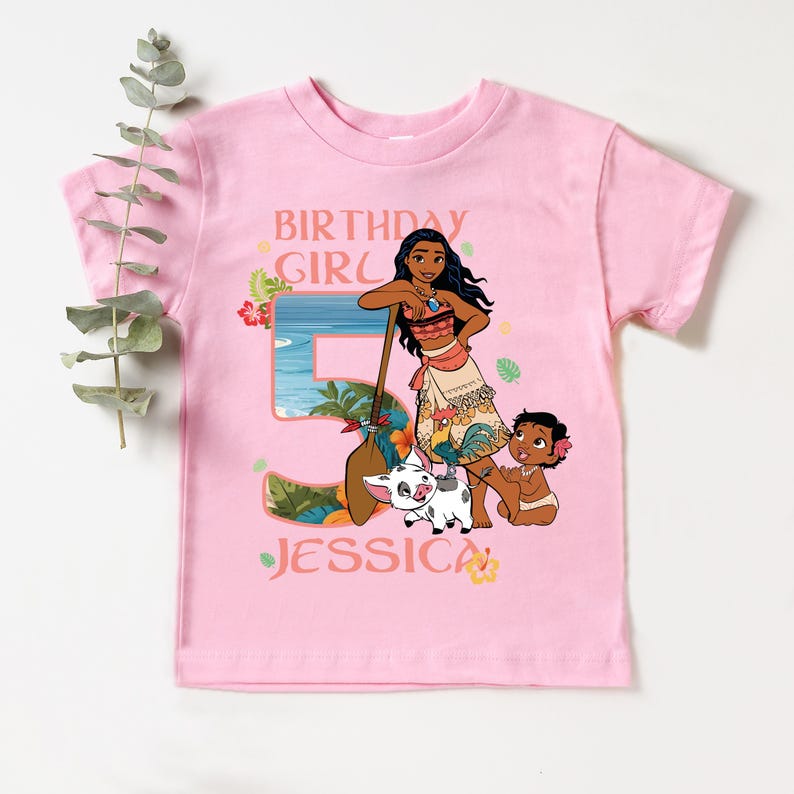 a pink shirt with a cartoon character on it