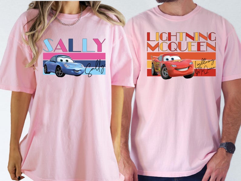 a man and a woman wearing matching pink shirts
