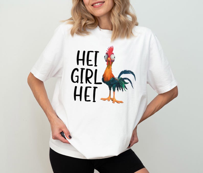 a woman wearing a white shirt with a rooster on it