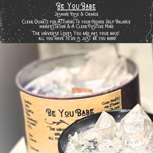 May include: A clear glass jar filled with clear quartz crystals. The jar has a brown label with the text "BE YOU BABE" and the words "Jasmine Rose & Orange". The label also includes the text "CLEAR QUARTZ FOR ATTUNING TO YOUR HIGHER SELF BALANCE MANIFESTATION & A CLEAR POSITIVE MIND THE UNIVERSE LOVES YOU AND HAS YOUR BACK! ALL YOU HAVE TO DO IS JUST BE YOU BABE!"