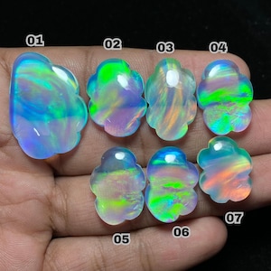 May include: Seven iridescent opal gemstones with a flower-like shape are displayed against a dark background. Each stone has a unique color play, including blues, greens, and oranges. The gemstones are numbered from 01 to 07.