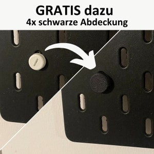 May include: Close-up of a pegboard with a white plastic peg and a black plastic peg. The text "GRATIS dazu 4x schwarze Abdeckung" is visible in the image.