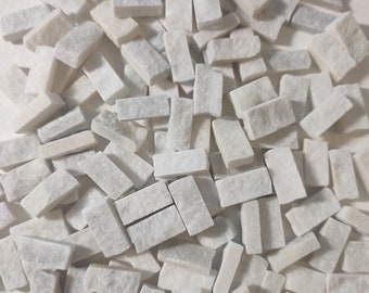 Hand-cut Italian marble mosaic tiles from Thassos White. 1 cm x 2 cm, 0.5 cm thick. 450g (approximately 120 pieces).