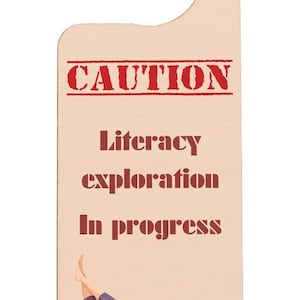 Caution: Literacy Exploration in Progress, Don’t Disturb, I’m Reading – Plywood Door Handle Hanger (doorh-kf23-caut)