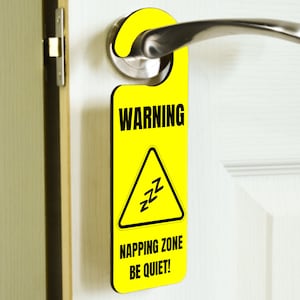 May include: Yellow door hanger with a warning sign that says "WARNING NAPPING ZONE BE QUIET!" with a black triangle and zzz's inside.