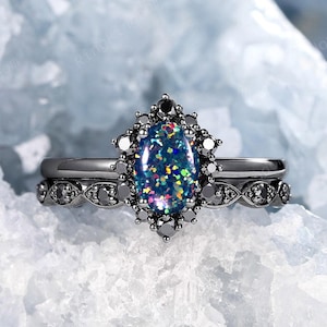 Oval Black Fire Opal Gothic Engagement Ring Set, Rhodium Black Gold Halo Black Moissanite Bridal Set, October Birthstone Witchy Wedding Ring