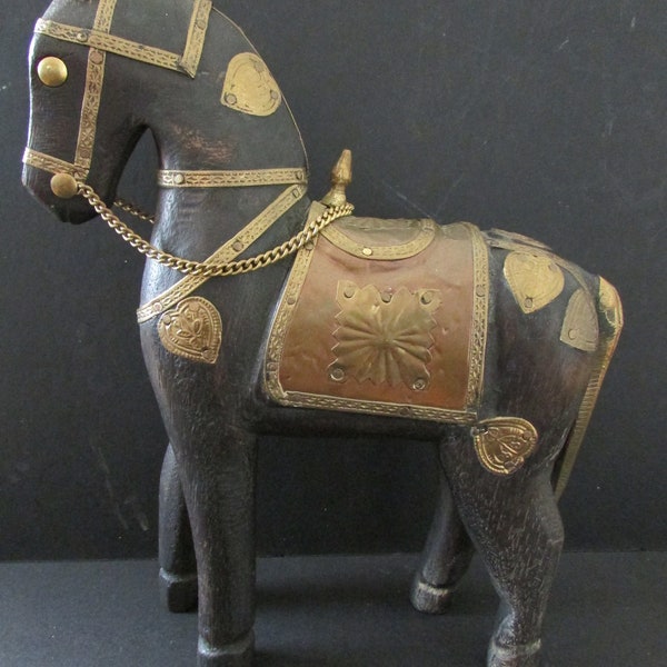 Antique wooden horse with copper fittings