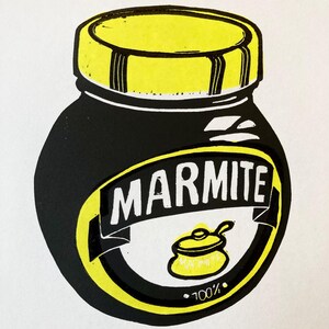 May include: A black and yellow illustration of a Marmite jar with the text "Marmite" and "100%" on the label. The text "Love it" is written below the jar.