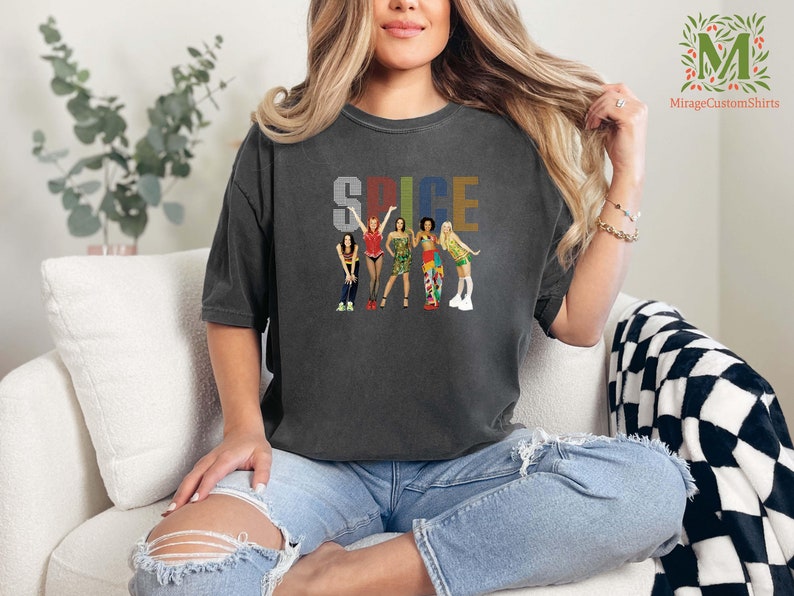 a woman sitting on a couch wearing a t - shirt that says spice