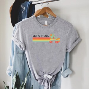 a t - shirt that says let's roll on it