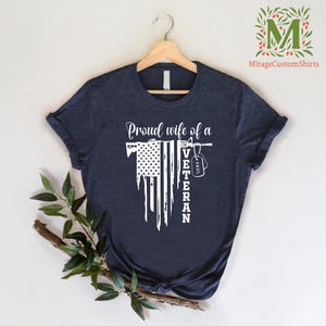 a t - shirt with american flag  and the word  proud wife of a veteran on it