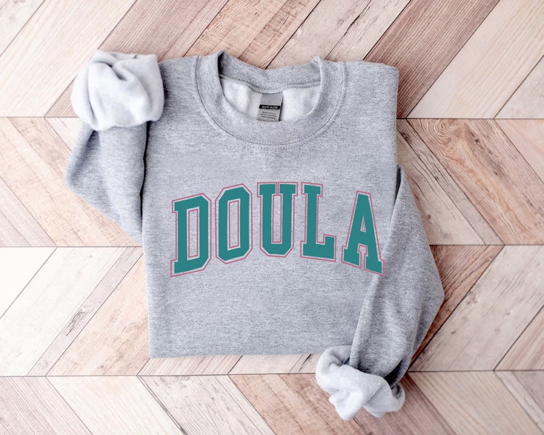a sweatshirt with the word doula on it