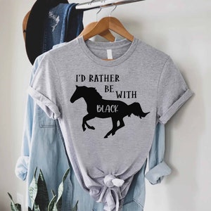 May include: Gray t-shirt with a black silhouette of a horse and the text "I'd rather be with black".