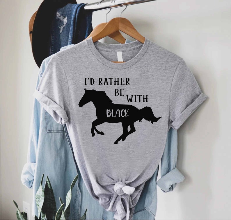 May include: Gray t-shirt with a black silhouette of a horse and the text "I'd rather be with black".