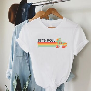 a t - shirt that says let's roll on it