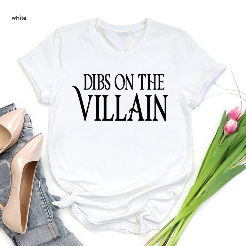 May include: White t-shirt with black text that reads "Dibs on the Villain".