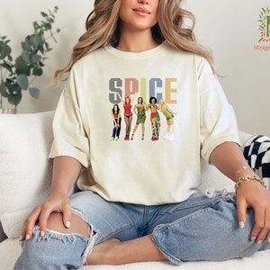 a woman sitting on top of a white couch