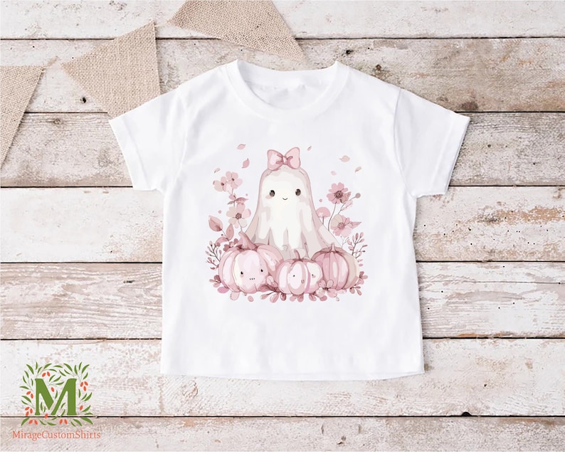 a white t - shirt with a picture of a bunny surrounded by pink flowers