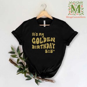 a black shirt that says it's my golden birthday