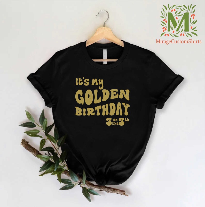 a black shirt that says it's my golden birthday