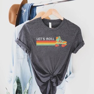 a t - shirt that says let's roll on it