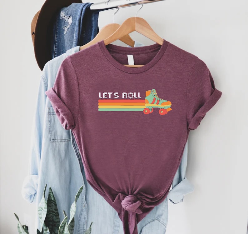 a t - shirt that says let's roll on it