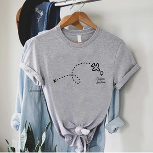 a t - shirt hanging on a clothes rack