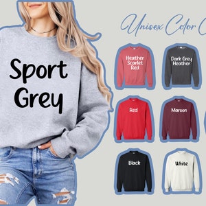 a woman wearing a sweatshirt that says sport grey