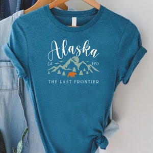 a pink shirt with the words alaska on it