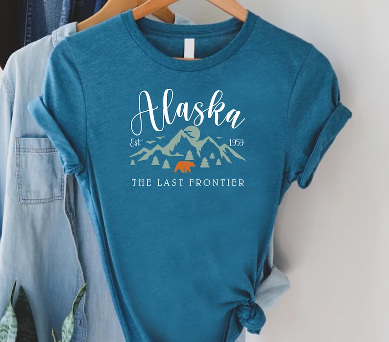 a pink shirt with the words alaska on it