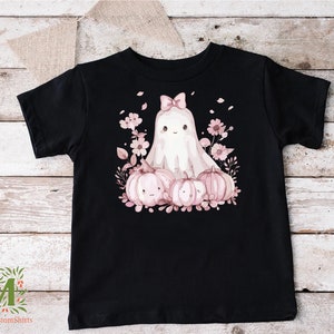 a black shirt with a ghost and pumpkins on it