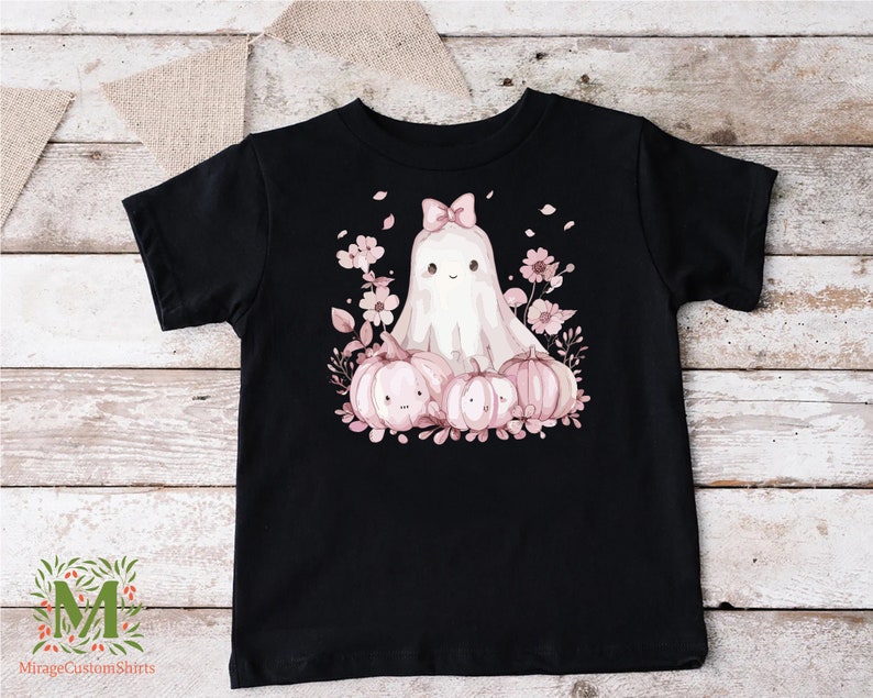 a black shirt with a ghost and pumpkins on it