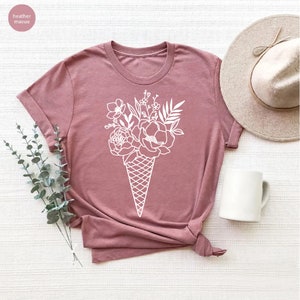 a t - shirt with a flower arrangement on it