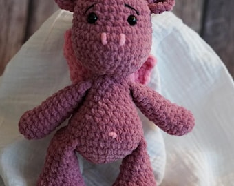 Pink dragon cuddly toy crocheted