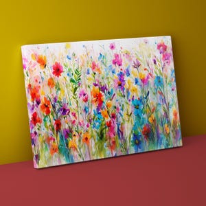 May include: A watercolor painting of a field of colorful wildflowers. The flowers are painted in shades of pink, purple, blue, yellow, orange, and red. The background is a soft white with hints of green.