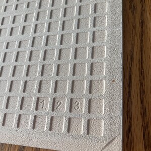 close up of Back of personalised tile